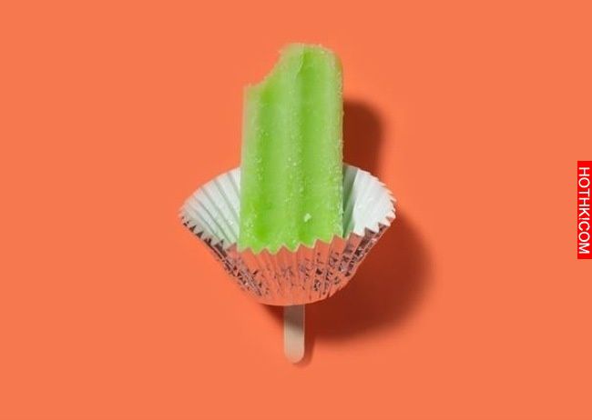A cupcake holder makes the perfect catcher for spills when having a popsicle.