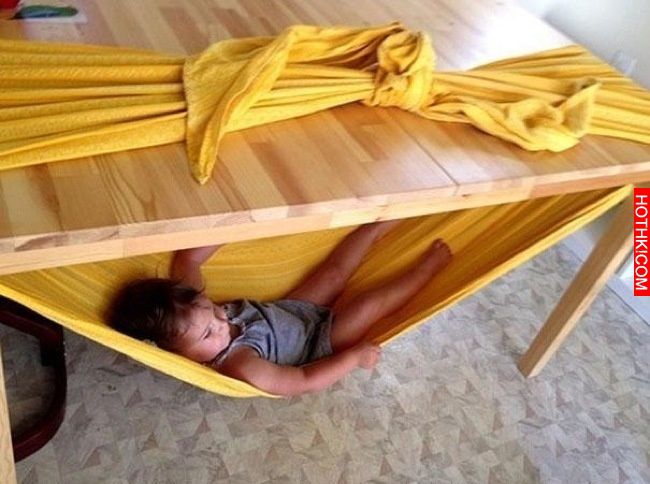 Make a kid hammock with some fabric and a sturdy table.